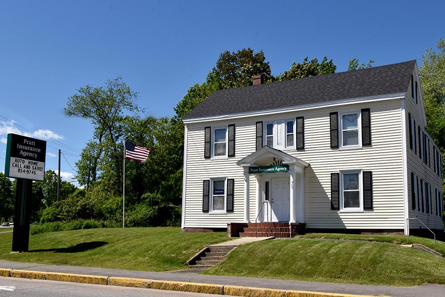 About Our Agency - Office Location of Pratt Insurance Agency in Westbrook, Maine, a White Building with Black Shutters