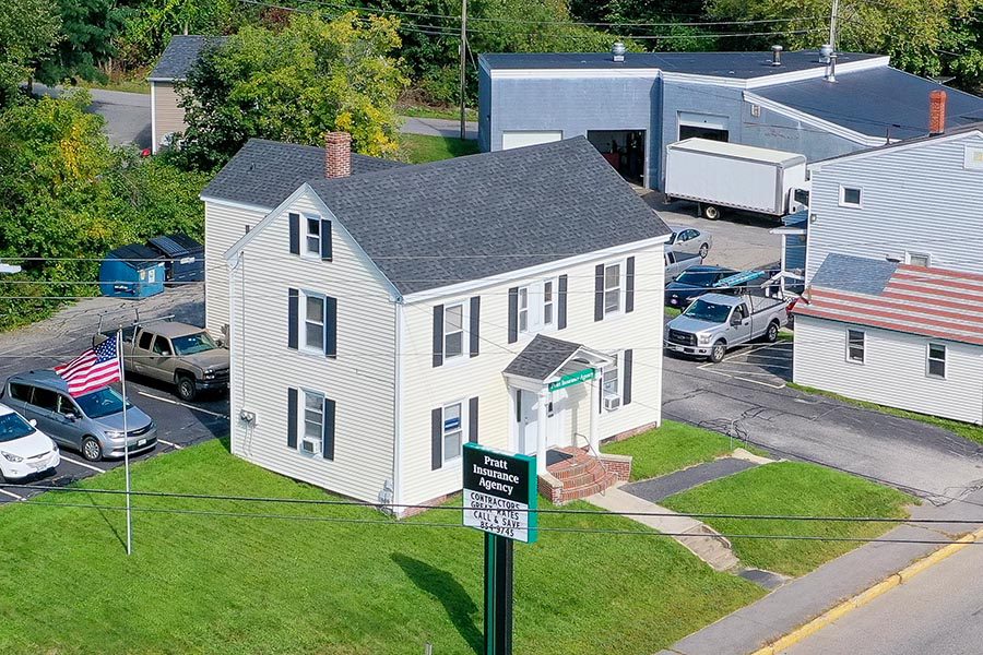 Westbrook, ME Insurance - Aerial View of Pratt Insurance Agency's White Sided Office with Black Shutters, in Westbrook, Maine
